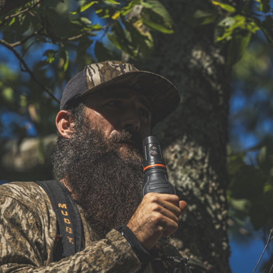 Man Holding Grunt'R while in tree