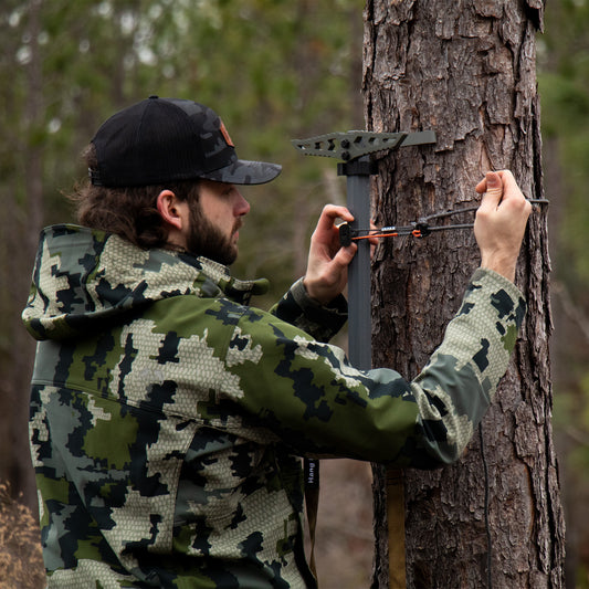 H.F.A.S. Being added to the tree on a climbing stick.