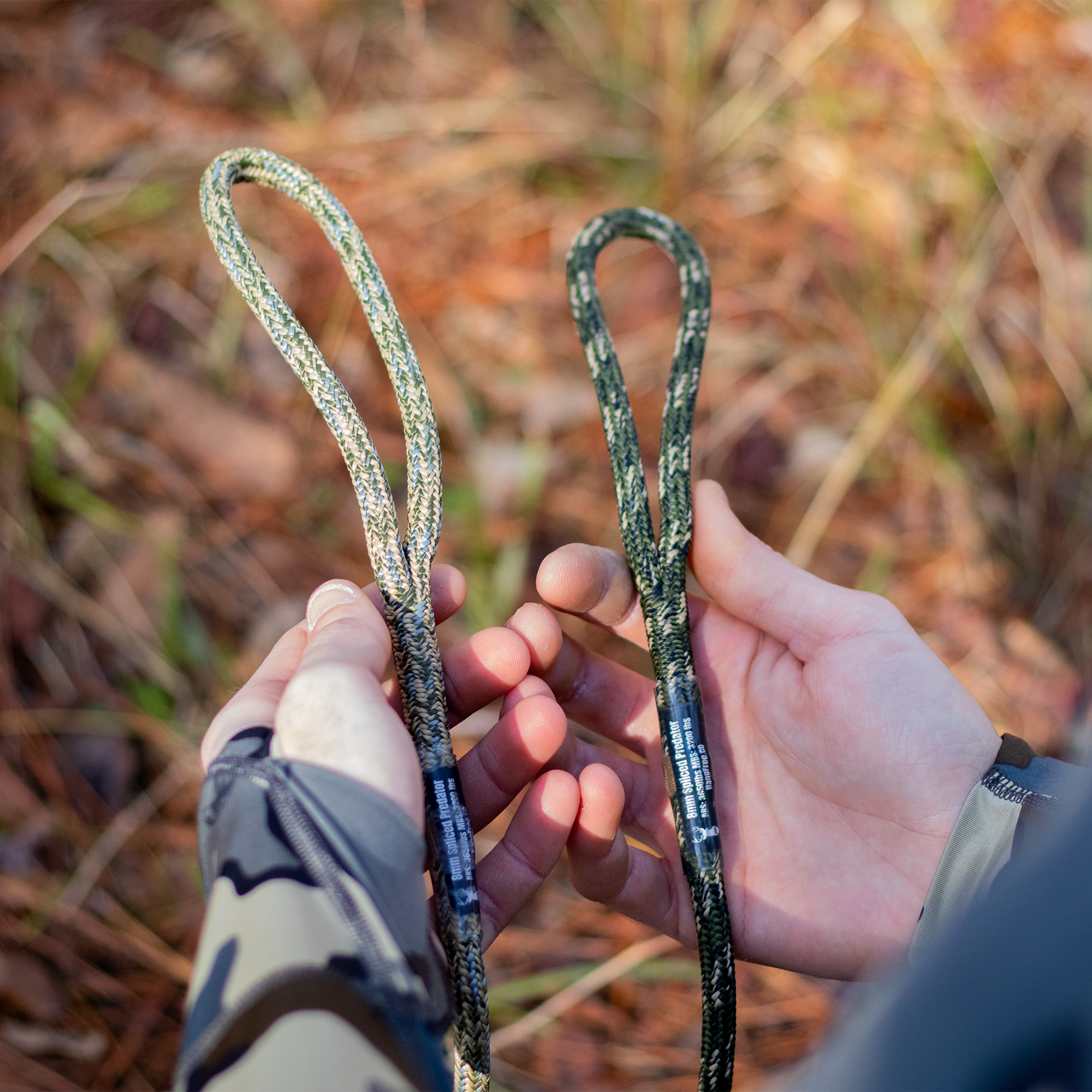 Spliced Predator Tethers in Desert and Predator Camo with Carabiner held in hand