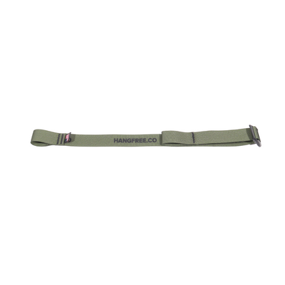 Climbing stick compression strap laying flat on ground.