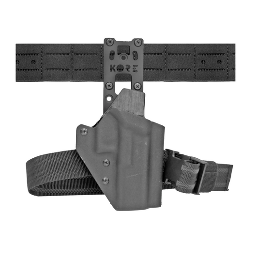 Kore Drop Down Holster with holster attached on belt.