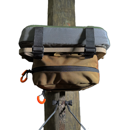 'SideKick' Saddle Bag o the underside of a Hang On Saddle Hunting stand.  Top zipper and Orange pull tabs can be seen.
