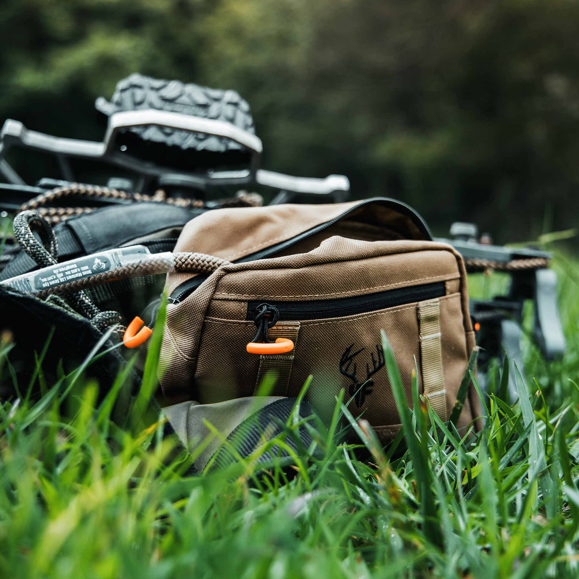 'SideKick' Saddle Bag In Use On saddle on the ground with rope coming out of the main pocket.